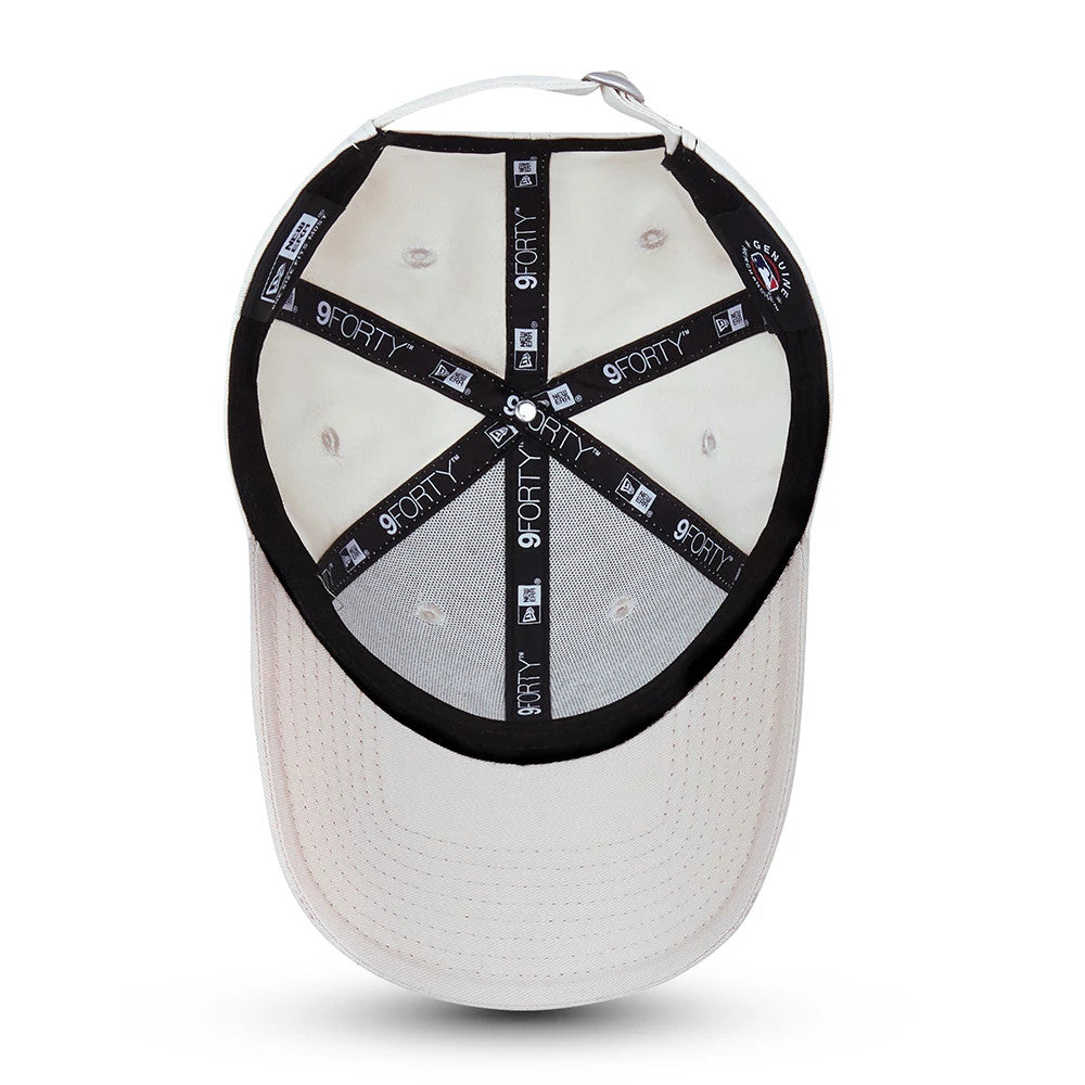 New York Yankees Tonal Womens Cream New Era 9FORTY Cap, inside view showing black branded taping with white 9FORTY text, cream sweatband, and the adjustable strap through the back eyelets.