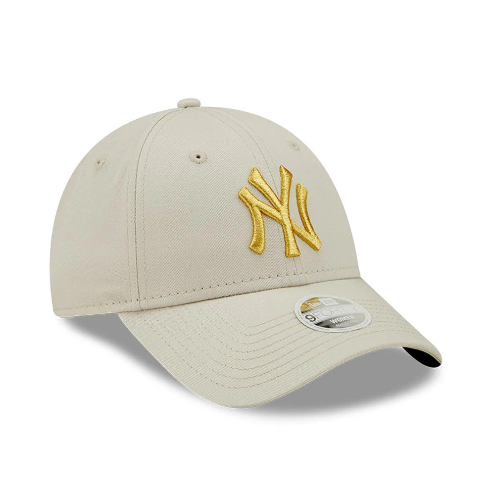 New York Yankees Womens Metallic Logo Cream New Era 9FORTY Adjustable Cap, front view showing a gold embroidered NY logo on the front panel, cream curved visor with a 9FORTY size sticker and tonal top button.