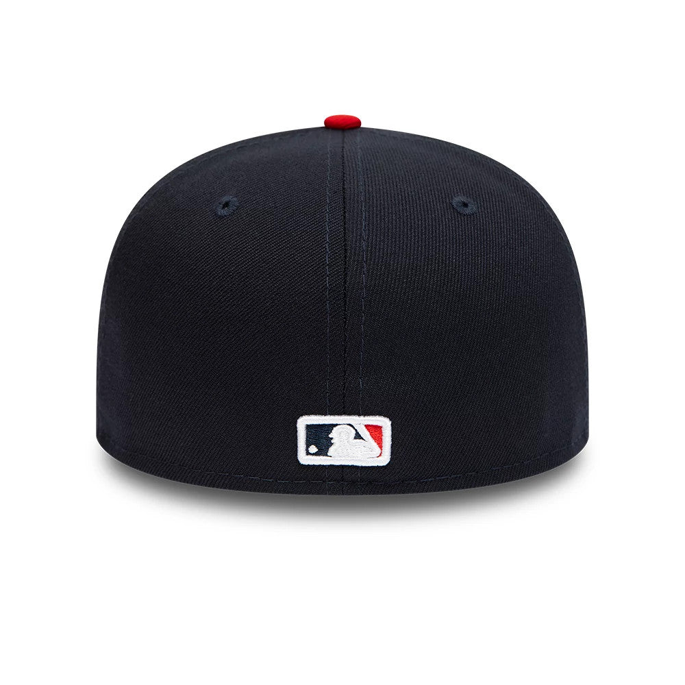 Cleveland Guardians Navy New Era 59FIFTY Fitted Cap, rear view showing the embroidered MLB Batterman logo in white, blue, and red at the centre of the back panels, with a red top button on the structured navy crown.