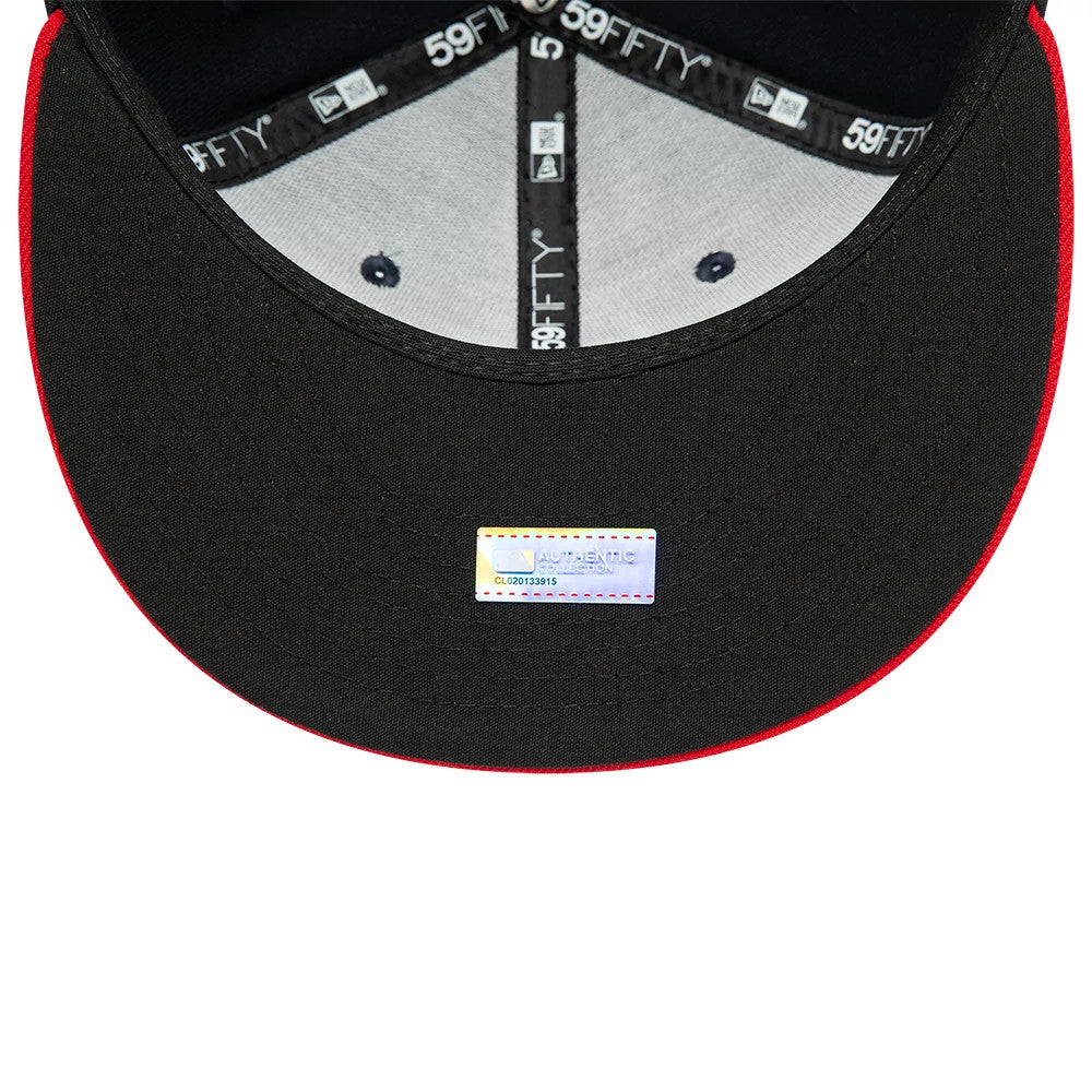 Cleveland Guardians Navy New Era 59FIFTY Fitted Cap, inside view showing black taping with white 59FIFTY branding, grey sweatband, black bottom side of the visor, and rectangular authenticity sticker centrally placed.