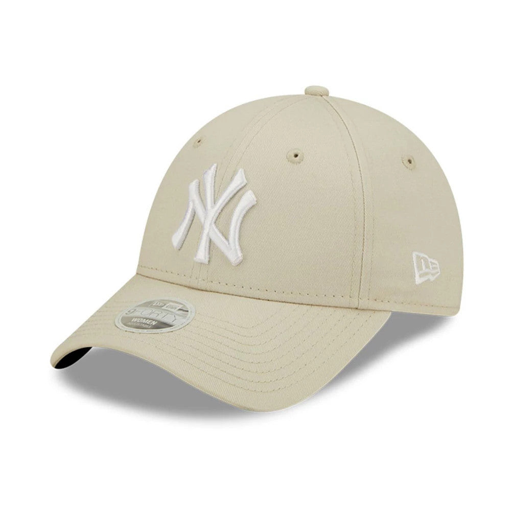 New York Yankees Womens League Essential Light Beige New Era 9FORTY Adjustable Cap, three-quarter view showing raised white NY logo on the front panel, matching beige curved visor with 9FORTY size sticker, and New Era flag logo on the left side.