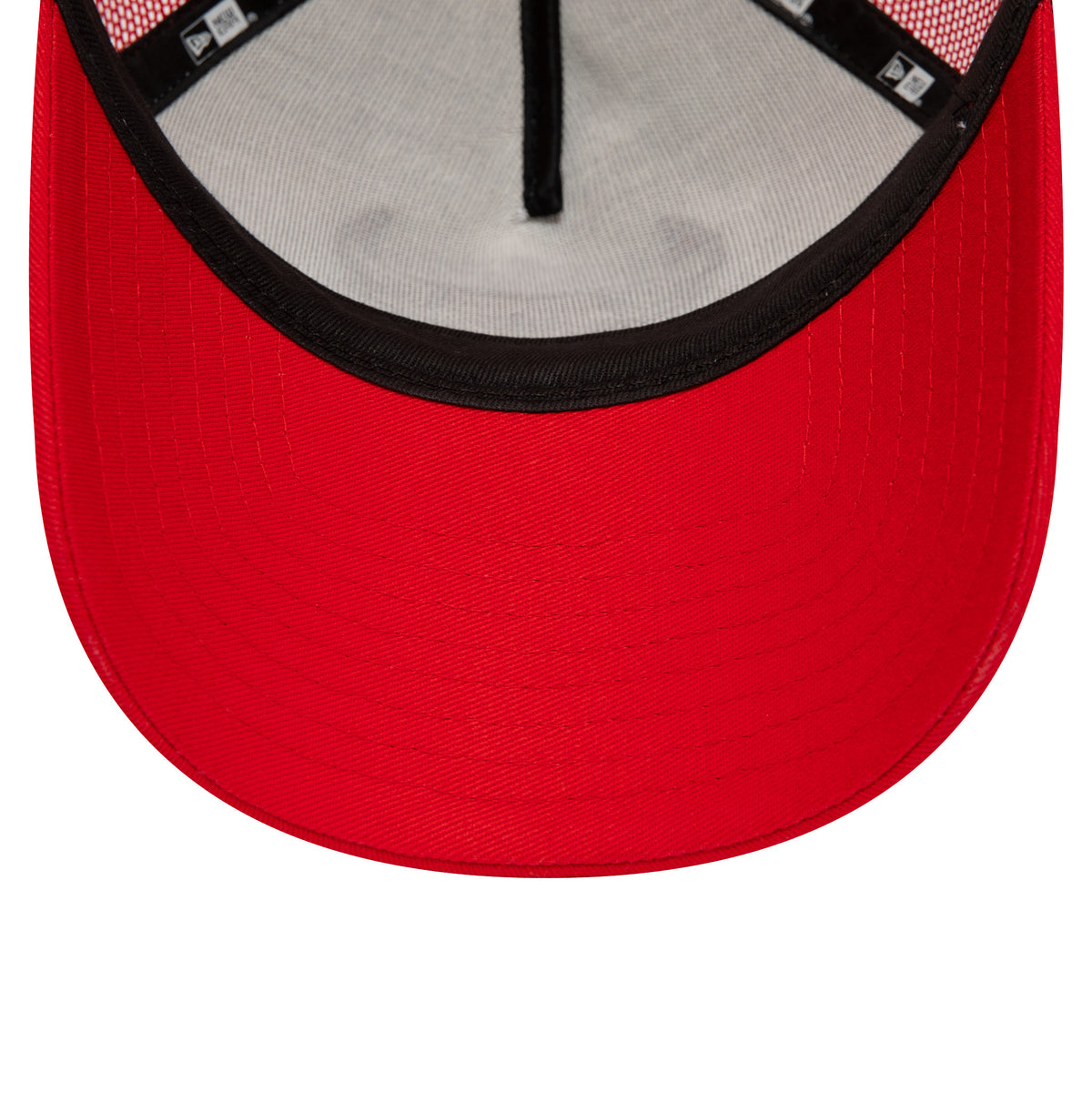 Chicago Bulls Team Colour Red A-Frame Trucker Cap, inside view showing black taping around the inner seams, a black sweatband, and a contrasting red undervisor with a smooth texture.