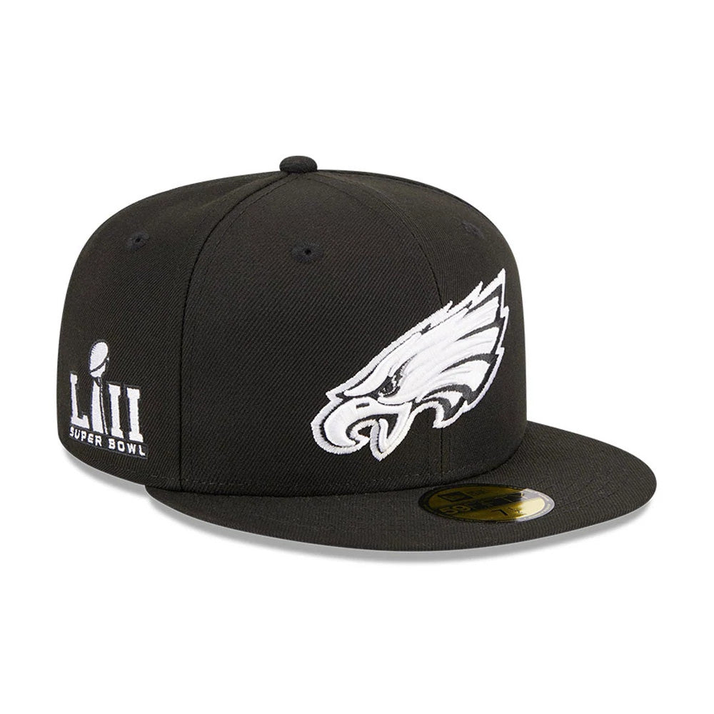 Philadelphia Eagles NFL Evergreen Black New Era 59FIFTY Fitted Cap, three-quarter view showing the white embroidered eagle logo on the front panel, the LIII Super Bowl graphic on the left side, and the gold 59FIFTY size sticker on the flat visor.
