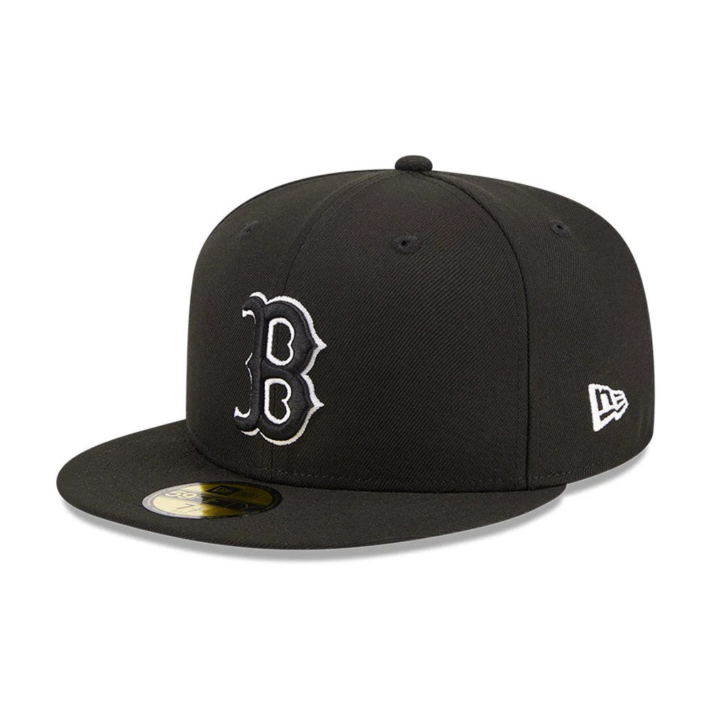 Boston Red Sox MLB Evergreen Black New Era 59FIFTY Fitted Cap, three-quarter view showing the white raised embroidered B logo on the front panel, black flat visor with gold 59FIFTY size sticker, and New Era flag logo on the left side.