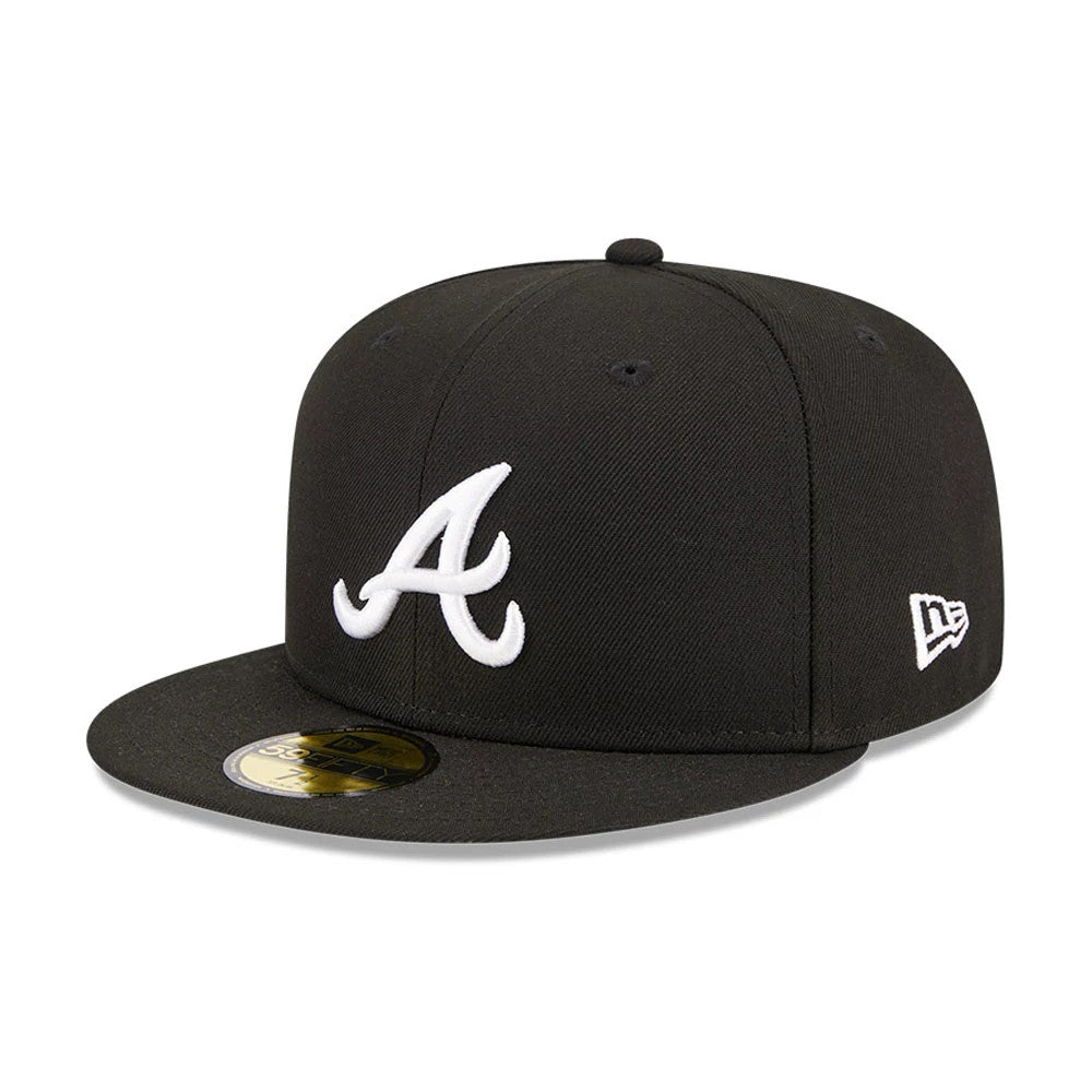 Atlanta Braves MLB Evergreen Black New Era 59FIFTY Fitted Cap, three-quarter view showing the white raised embroidered A logo on the front panel, black flat visor with gold 59FIFTY size sticker, and New Era flag logo on the left side.