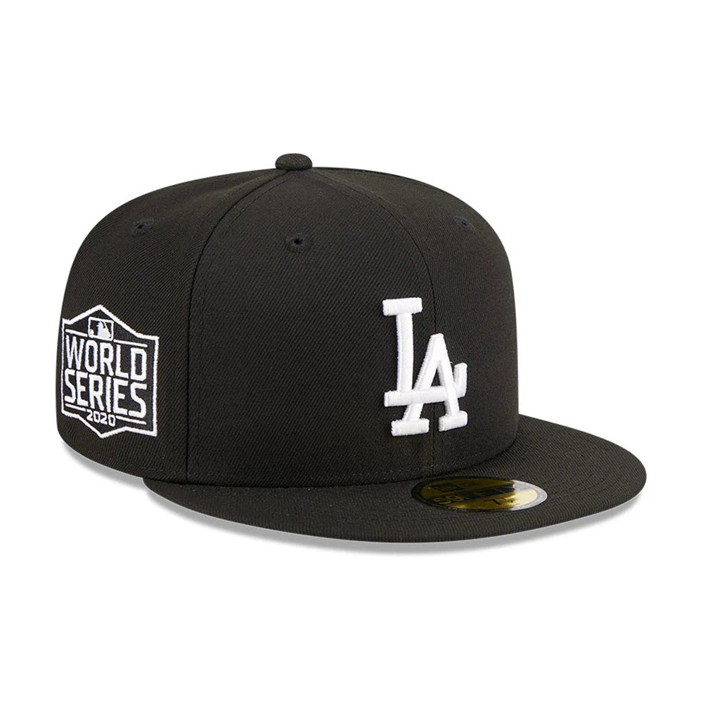 LA Dodgers MLB Evergreen Black New Era 59FIFTY Fitted Cap, three-quarter view showing the raised white LA logo on the front panel, the white World Series 2020 patch on the left side, and the gold 59FIFTY size sticker on the flat visor.