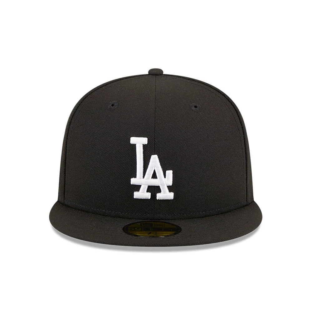 LA Dodgers MLB Evergreen Black New Era 59FIFTY Fitted Cap, front view showing a white embroidered LA logo on the structured black crown, with a black visor and a gold 59FIFTY size sticker on top.