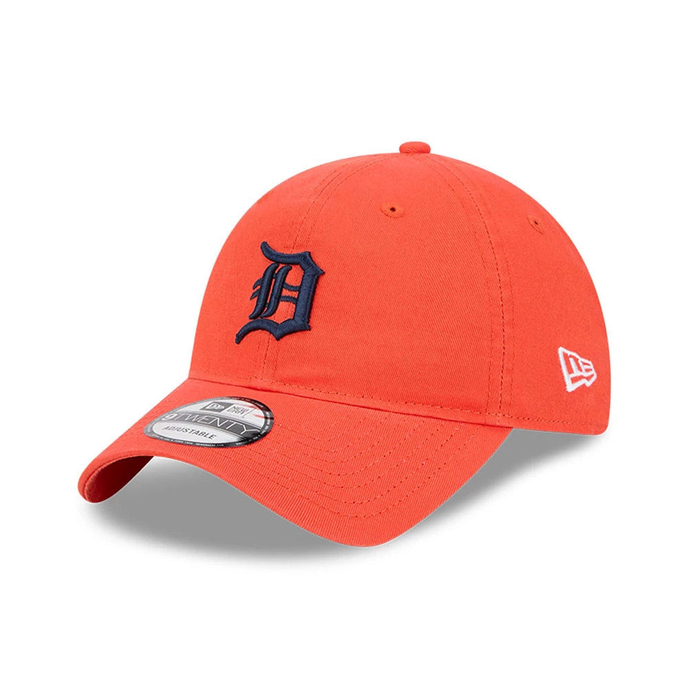 Detroit Tigers MLB Evergreen Orange New Era 9TWENTY Adjustable Cap, three-quarter view showing the navy embroidered D logo on the front panel, orange curved visor with a 9TWENTY size sticker, and the New Era flag logo on the left side.