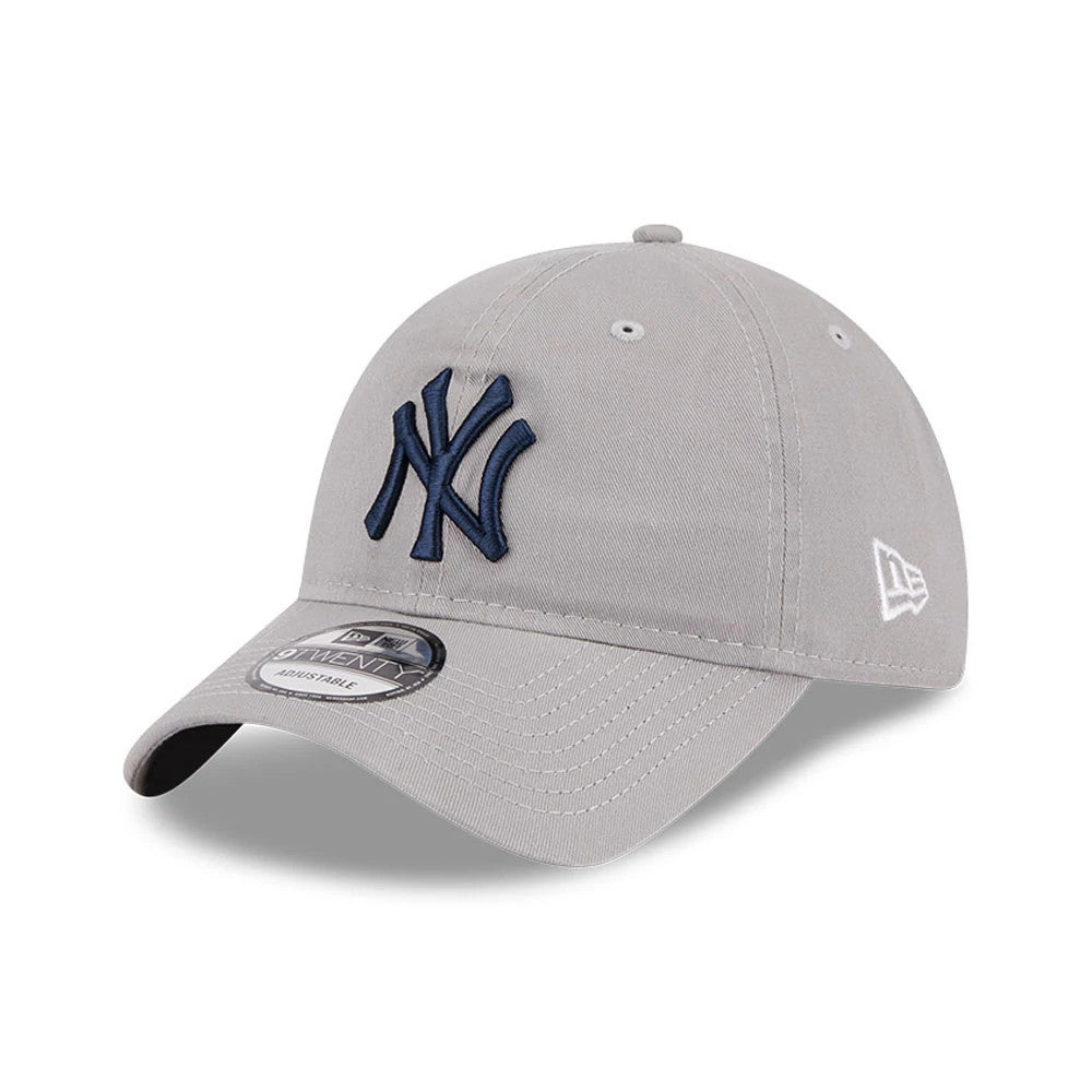 New York Yankees MLB Evergreen Grey New Era 9TWENTY Adjustable Cap, three-quarter view showing the raised navy NY logo on the front panel, white New Era flag logo on the left side, and 9TWENTY size sticker on the curved visor.