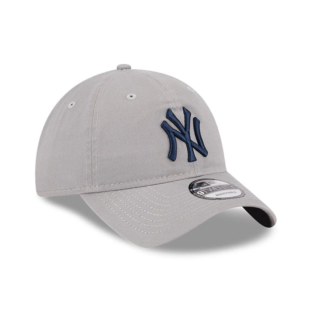 New York Yankees MLB Evergreen Grey New Era 9TWENTY Adjustable Cap, three-quarter view showing the navy raised embroidered NY logo on the front panel, grey curved visor, and 9TWENTY size sticker on top of the visor.