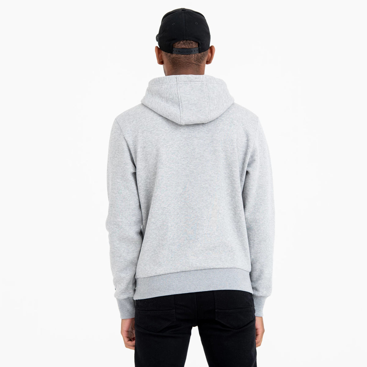 New York Yankees MLB Regular Grey Pullover Hoodie, rear view showing the light grey hood resting on the upper back, long sleeves extending down the arms, and the black cap worn by the person underneath the hood.