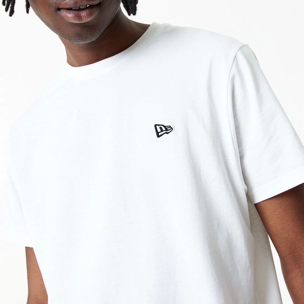 New Era Essential White T-Shirt, front view featuring a raised black New Era logo embroidered on the left chest, short sleeves, and a clean white finish on the simple crew neck design.