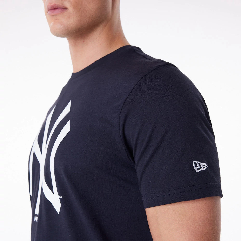 New York Yankees MLB Regular Navy T-Shirt, side view showing the large white New York Yankees logo on the chest, the short sleeve with a raised New Era logo near the cuff, and the dark navy fabric fitted to a male model's upper body.