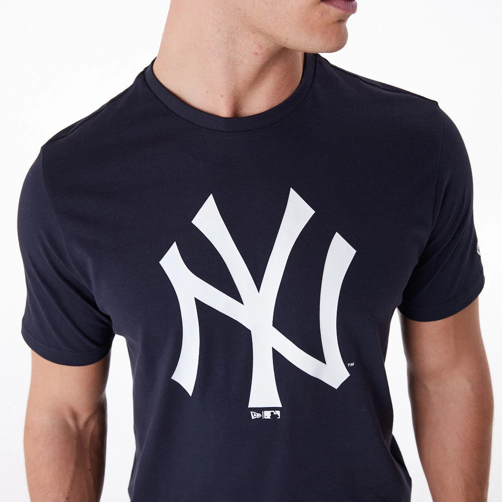 New York Yankees MLB Regular Navy T-Shirt, front view showing a large white Yankees logo centred on the chest and a small New Era logo beneath, worn by a person with short sleeves visible.