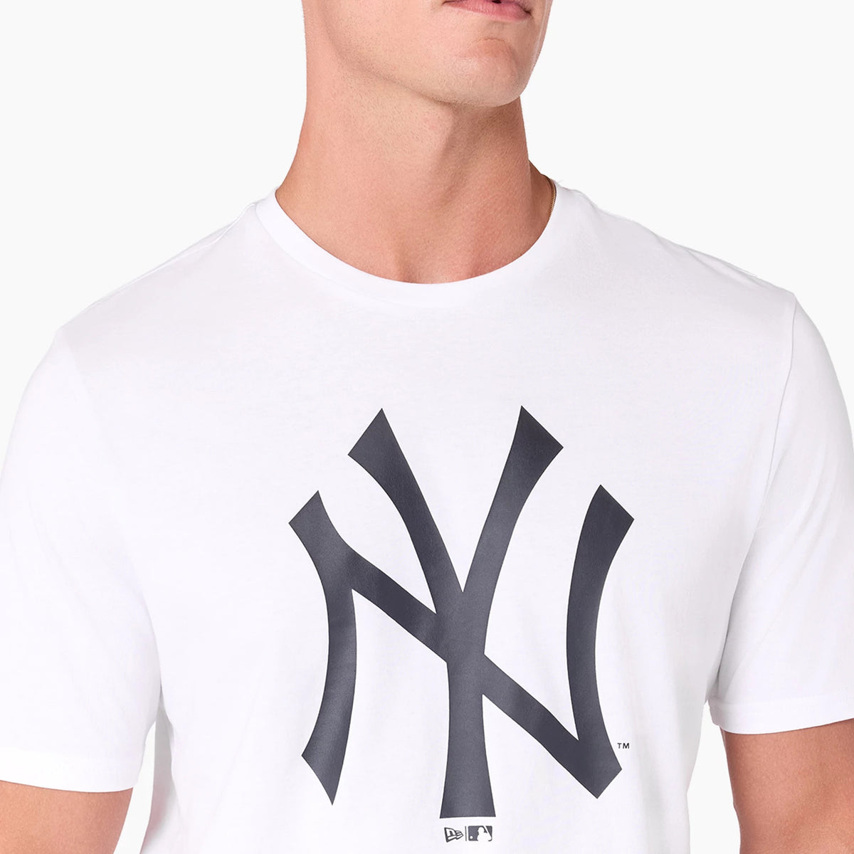 New York Yankees MLB White T-Shirt, front view showing a large black New York Yankees logo printed on the chest area, short sleeves, and a simple round neckline on a plain white shirt.