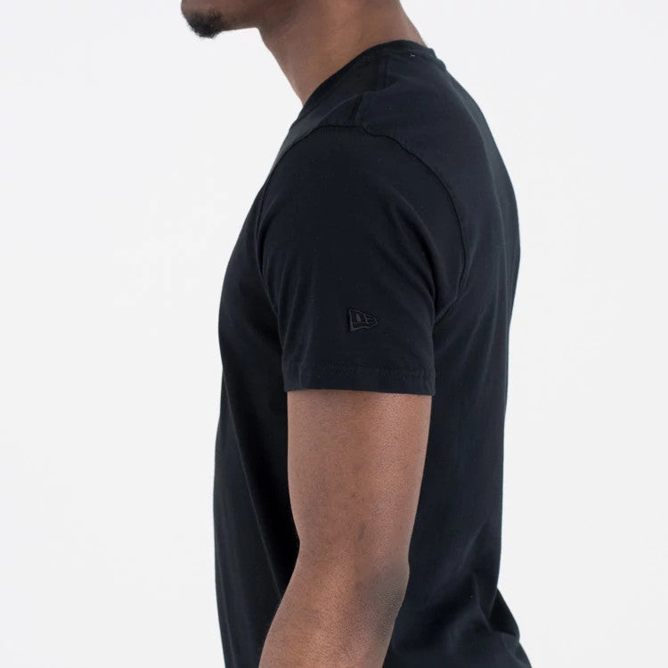 New Era Chicago Bulls NBA Regular Black On Black T-Shirt, side view showing the straight cut short sleeve with a raised New Era logo on the upper arm against the plain black fabric.