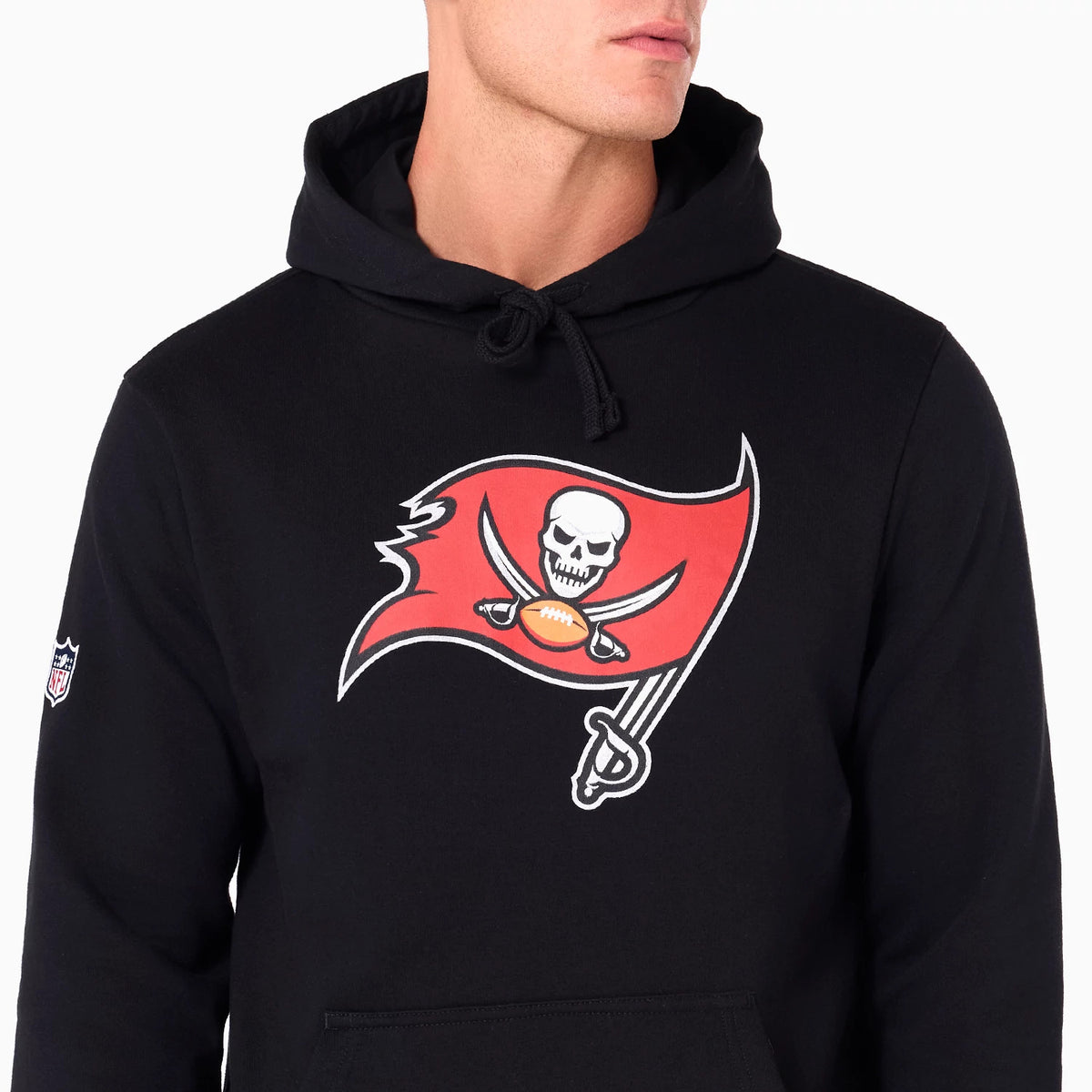 New Era Tampa Bay Buccaneers NFL Black Pullover Hoodie, front view showing a large red flag with a skull and crossed swords printed on the chest, a drawstring hood, and a small embroidered logo on the sleeve.