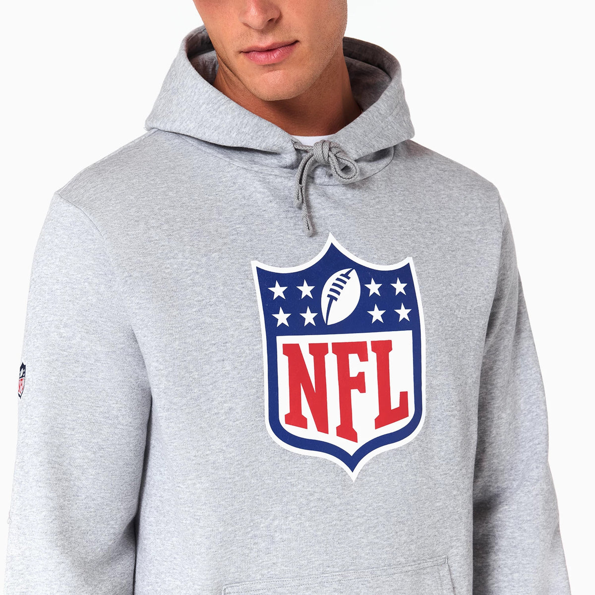 NFL Shield Logo NFL Grey Pullover Hoodie, front view showcasing the bold NFL shield logo in red, blue, and white on the chest, with a drawstring hood and a small embroidered logo on the sleeve.