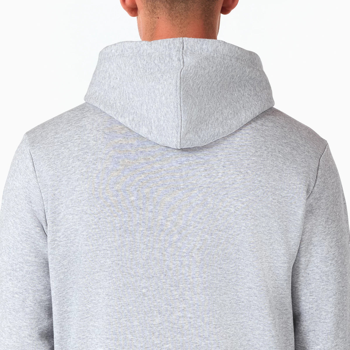 NFL Shield Logo NFL Grey Pullover Hoodie, rear view showing the plain light grey fabric, with a spacious hood slightly draped over the back and no visible logos or designs on the back panel.