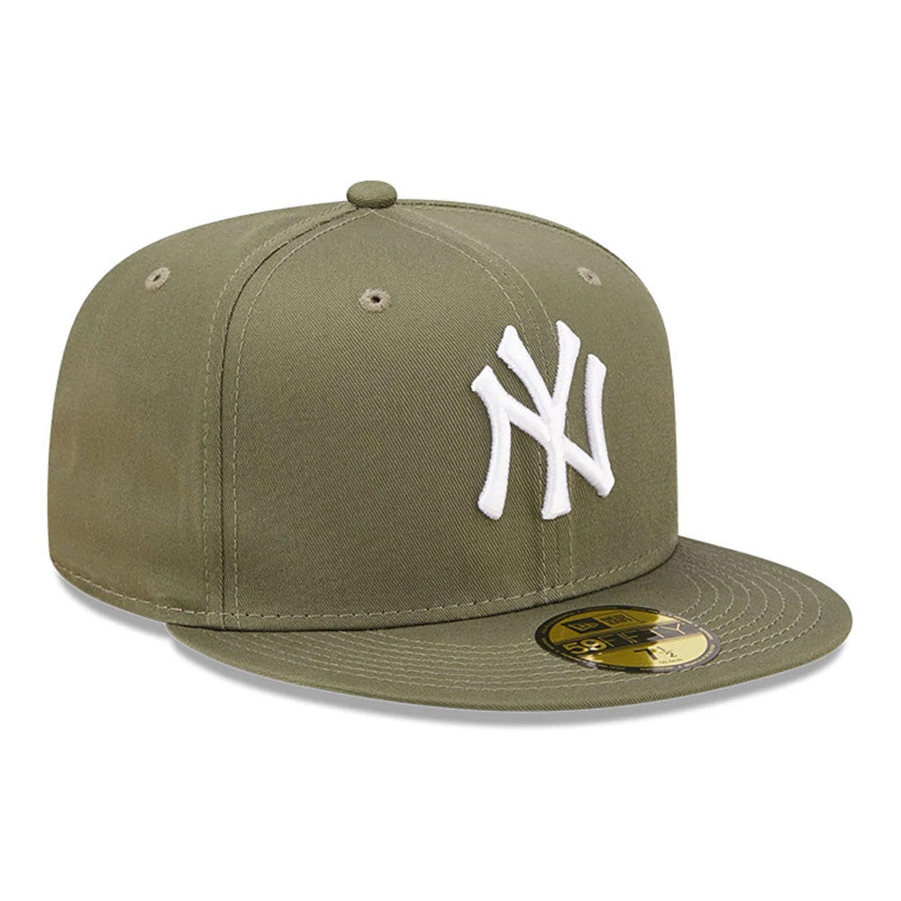 New York Yankees League Essential Green New Era 59FIFTY Fitted Cap, three-quarter view showing the raised white Yankees logo embroidered on the front panel, with olive green visor and gold 59FIFTY size sticker on top.