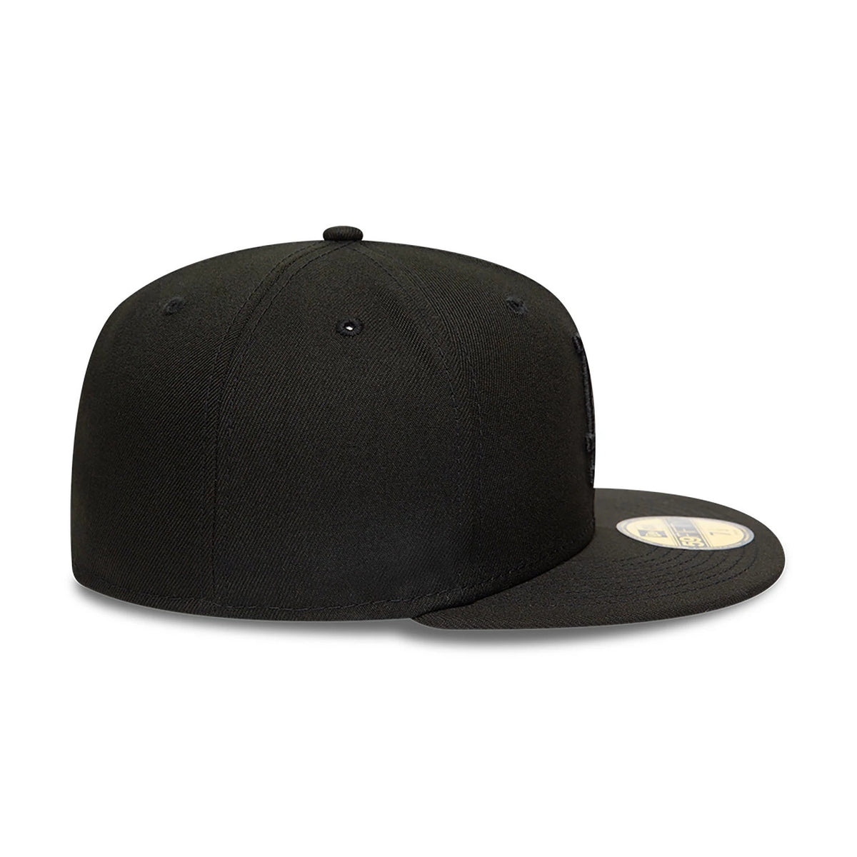 LA Dodgers MLB Black on Black New Era 59FIFTY Fitted Cap, side view showing the black New Era flag logo embroidered on the left side, a structured crown, and the gold 59FIFTY size sticker on the flat visor.