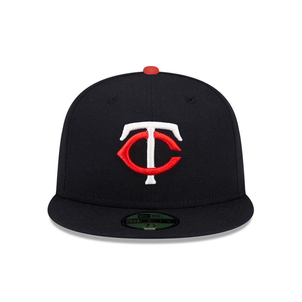 Minnesota Twins MLB Authentic On Field Navy New Era 59FIFTY Fitted Cap, front view showing raised red and white TC logo embroidered on the centre front, navy flat visor with a gold 59FIFTY size sticker, and a red top button on the crown.