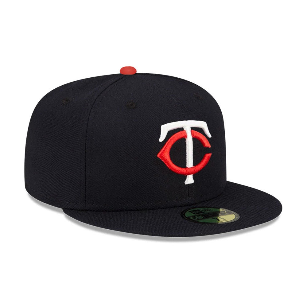 Minnesota Twins MLB Authentic On Field Navy New Era 59FIFTY Fitted Cap, front view showing the red and white embroidered TC logo on the front panel, with a red top button and a gold 59FIFTY size sticker on the flat visor.