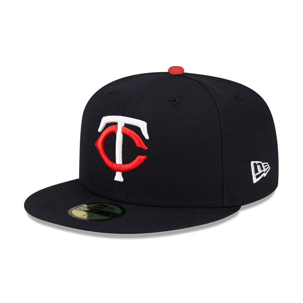 Minnesota Twins MLB Authentic On Field Navy New Era 59FIFTY Fitted Cap, front view showing the raised embroidered red and white TC logo on the navy crown, navy visor with a gold 59FIFTY size sticker, and New Era flag logo on the left side.