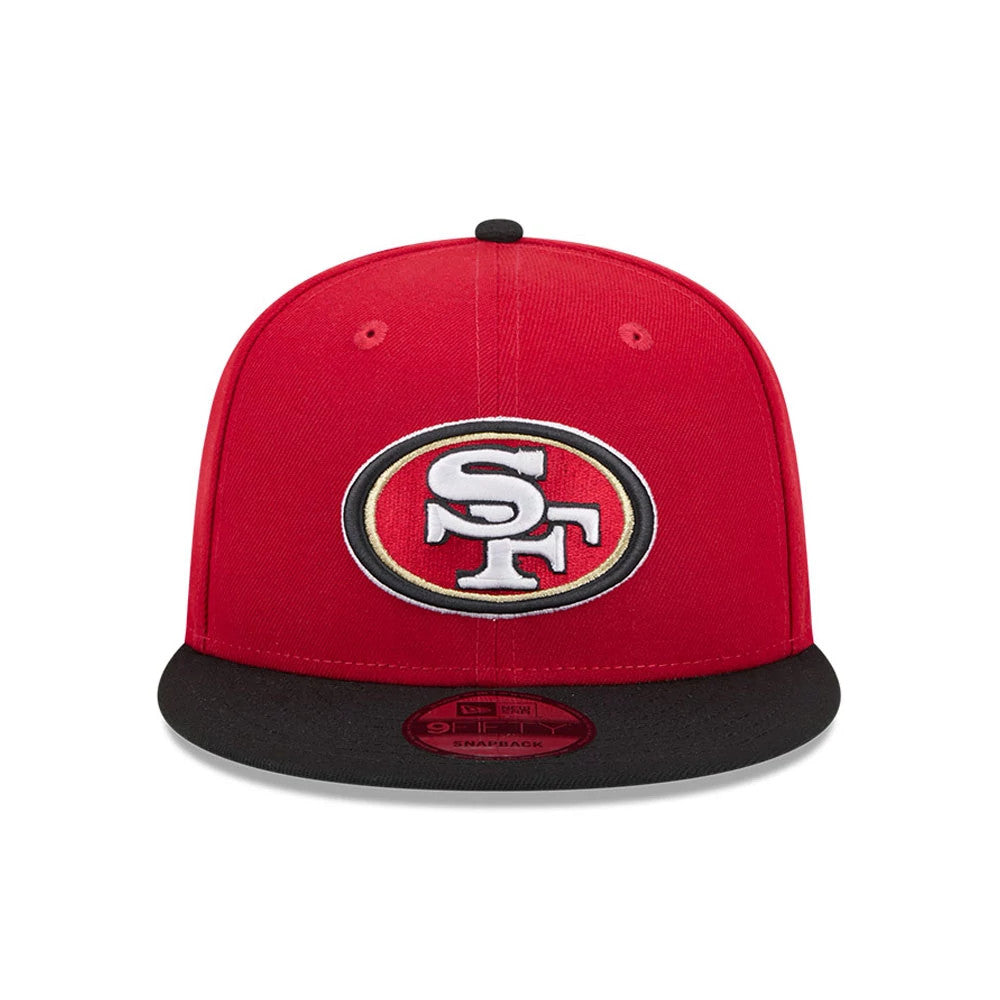 San Francisco 49ers NFL Evergreen Red New Era 9FIFTY Snapback Adjustable Cap, front view showing the raised embroidered SF logo on red crown with a black visor and 9FIFTY size sticker at the centre.