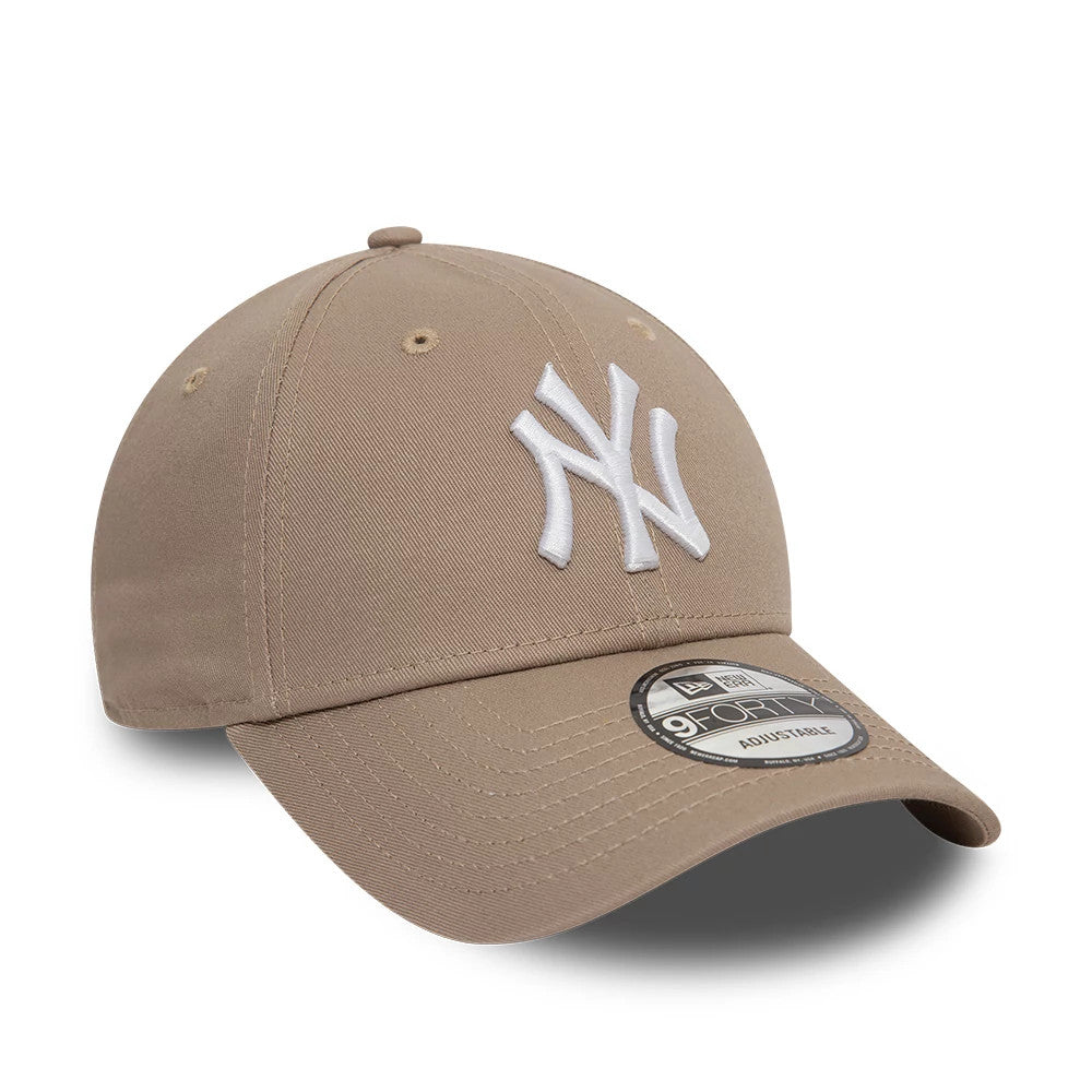 New York Yankees League Essential Pastel Brown New Era 9FORTY Adjustable Cap, front view showing the raised white NY logo embroidered on the front panel, curved visor with a 9FORTY size sticker, and top button matching the pastel brown fabric.