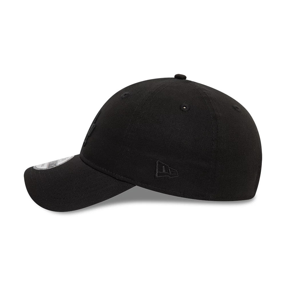 LA Dodgers League Essential Black New Era 9TWENTY Adjustable Cap, side view showing the tonal New Era flag logo embroidered on the left side, with a curved visor and 9TWENTY size sticker on the edge.