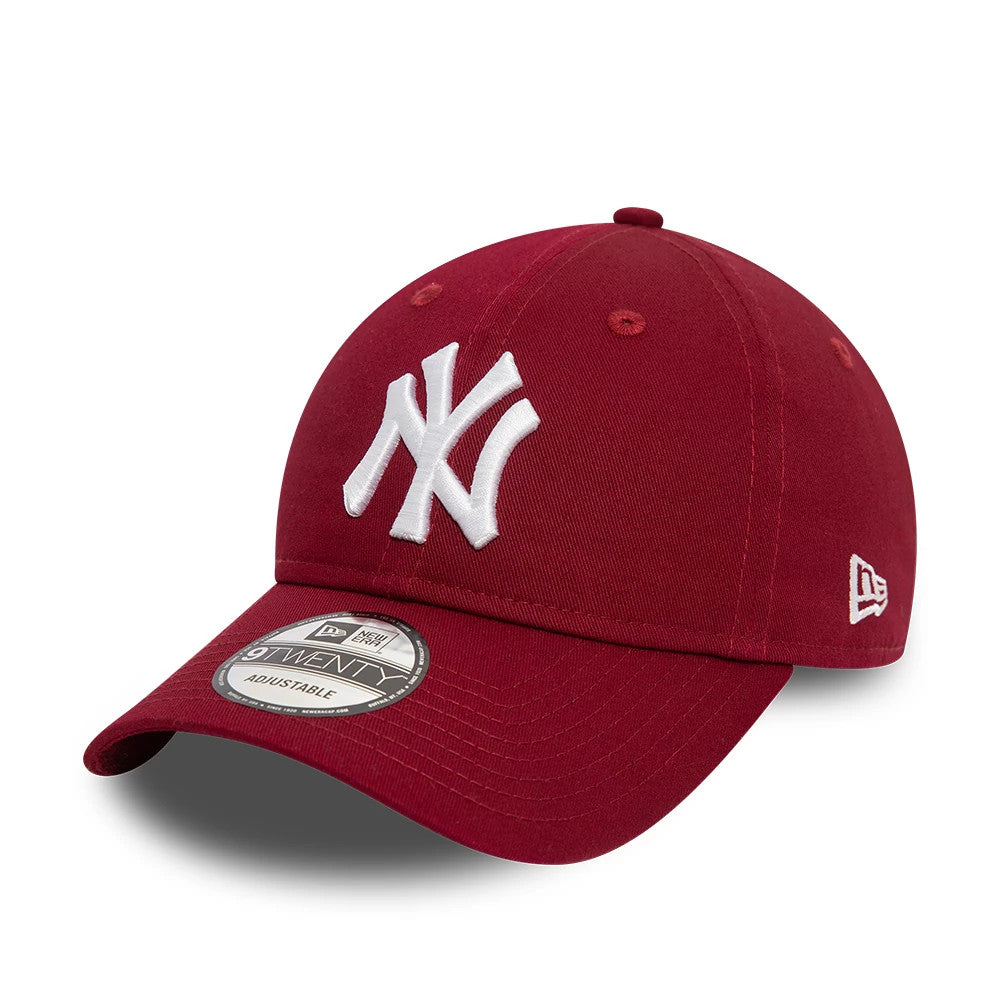 New York Yankees League Essential Dark Red New Era 9TWENTY Adjustable Cap, three-quarter view showing the raised white NY logo on the front panel, curved visor with a 9TWENTY size sticker, and the New Era flag logo on the left side.
