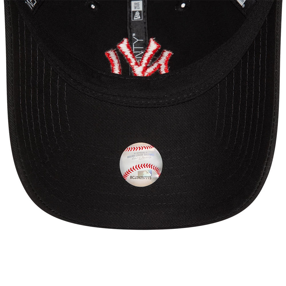 New York Yankees League Essential Black New Era 9TWENTY Adjustable Cap, inside view showing black sweatband, branded taping, and an MLB sticker on the underside of the black visor.