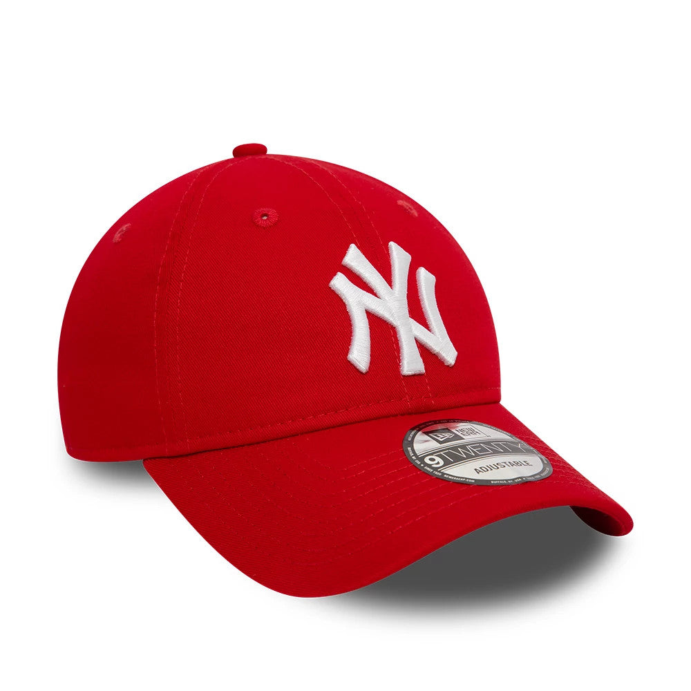 New York Yankees League Essential Red New Era 9TWENTY Adjustable Cap, front view showing the raised white embroidered NY logo on the red crown with matching red eyelets and a curved visor with a 9TWENTY size sticker.