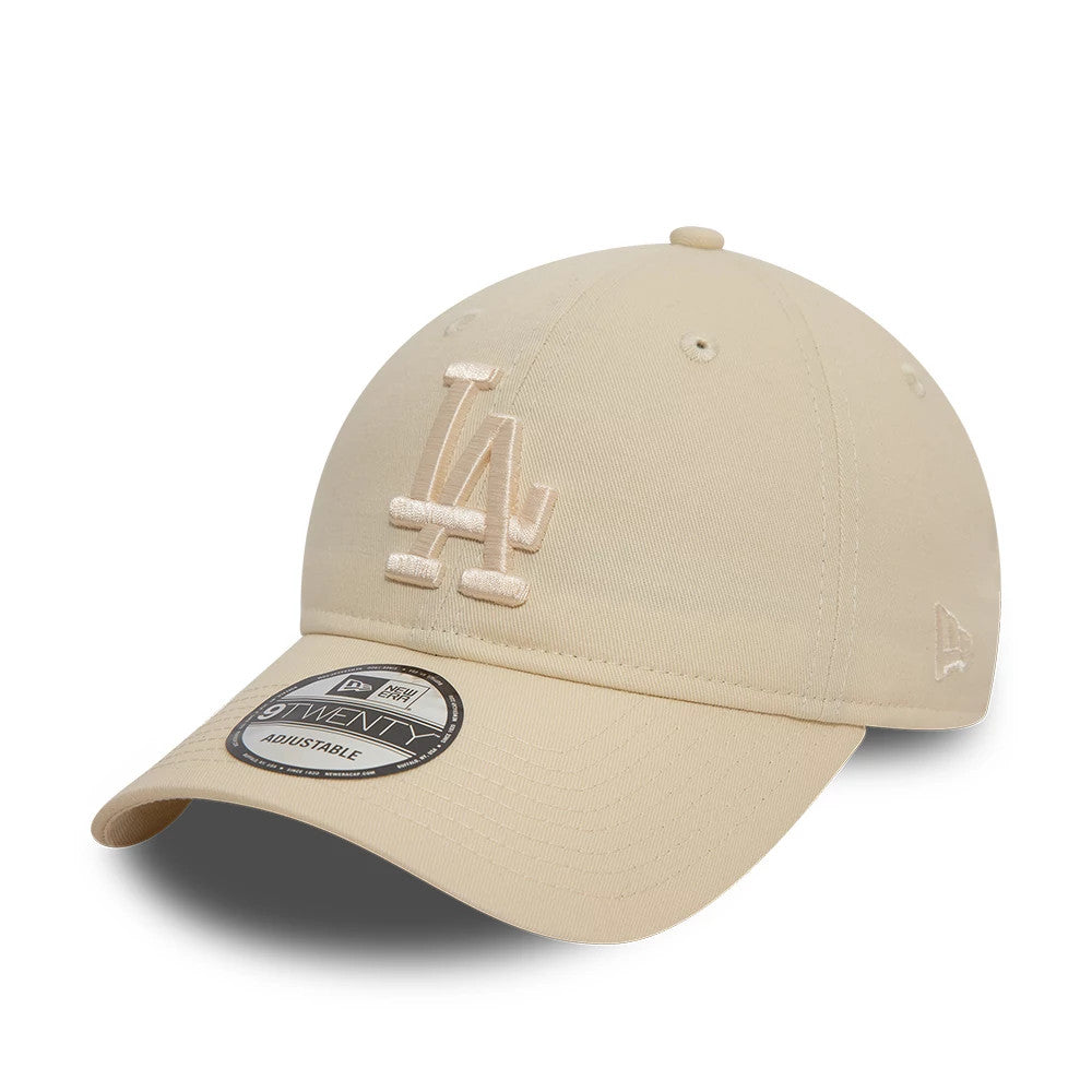 LA Dodgers League Essential Stone New Era 9TWENTY Adjustable Cap, three-quarter view showing the raised embroidered LA logo on the front panel, an off-white hue, and the 9TWENTY size sticker on the curved visor.