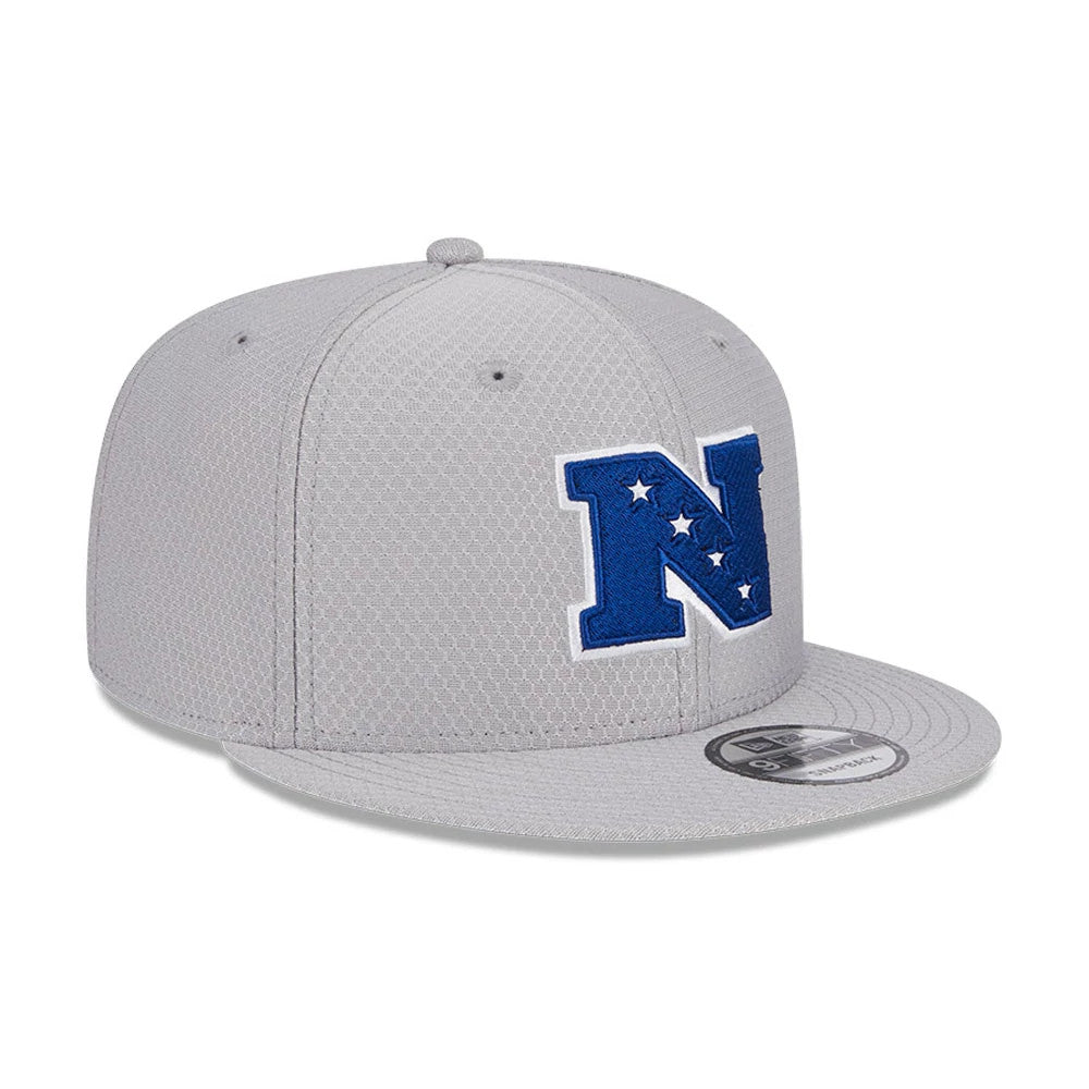 NFL Pro Bowl 2025 NFC Logo Grey New Era 9FIFTY Snapback Adjustable Cap, three-quarter view showing a raised blue N logo with stars on the front panel, a 9FIFTY size sticker on the grey flat visor, and structured grey crown.