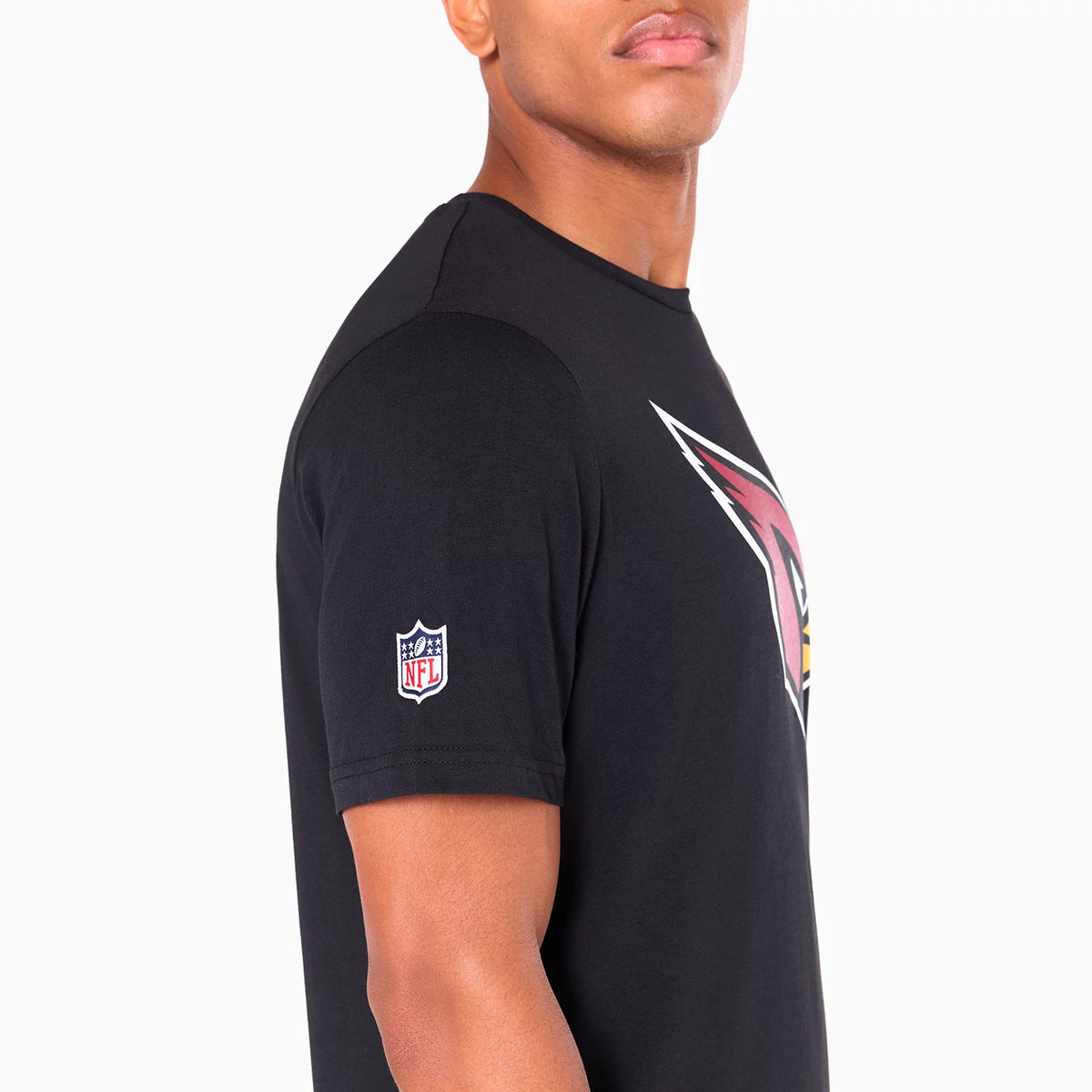 New Era Arizona Cardinals NFL Black T-Shirt, side view showing the black fabric with a large Arizona Cardinals logo in red and white on the front and an embroidered NFL shield logo on the left sleeve.