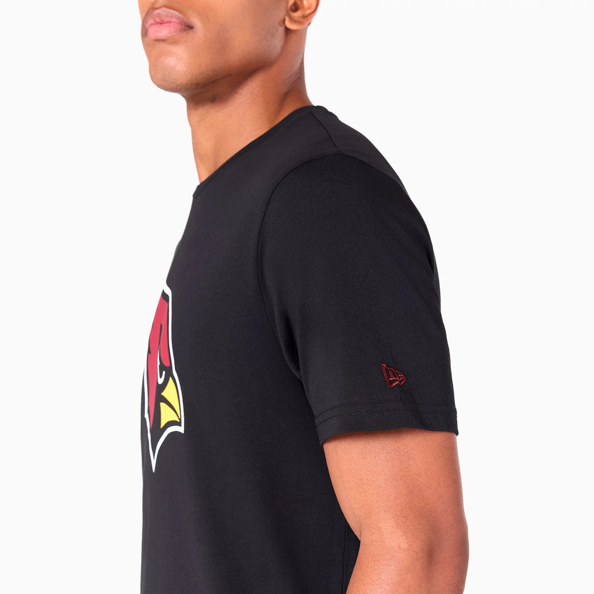 New Era Arizona Cardinals NFL Black T-Shirt, side view showing a large red and yellow Cardinals logo on the chest, with a raised New Era logo embroidered on the sleeve near the edge.