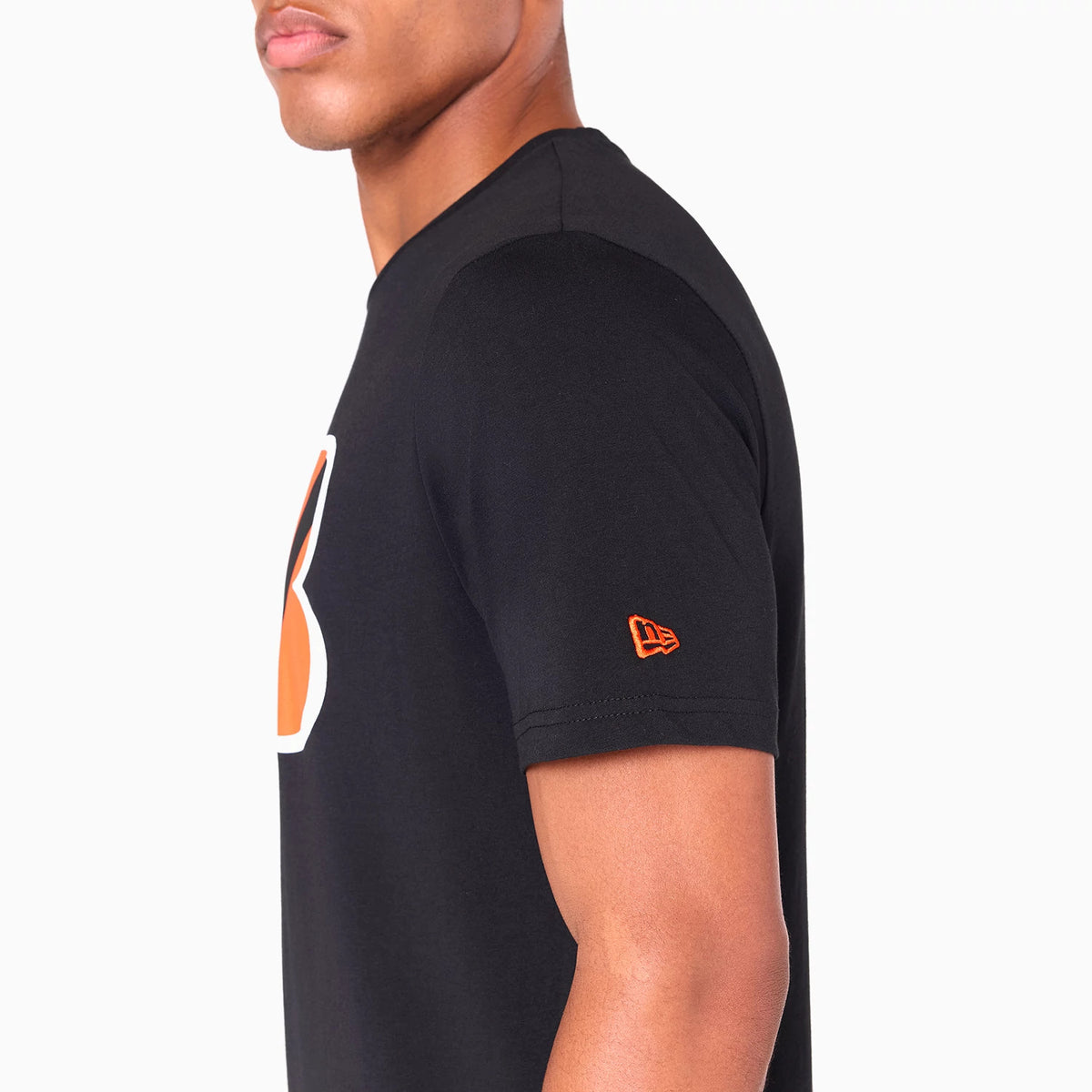 New Era Cincinnati Bengals NFL Black T-Shirt, side view showing a large orange and white team logo on the chest, the black short sleeve with an orange raised New Era logo near the hem, and a crew neck design.