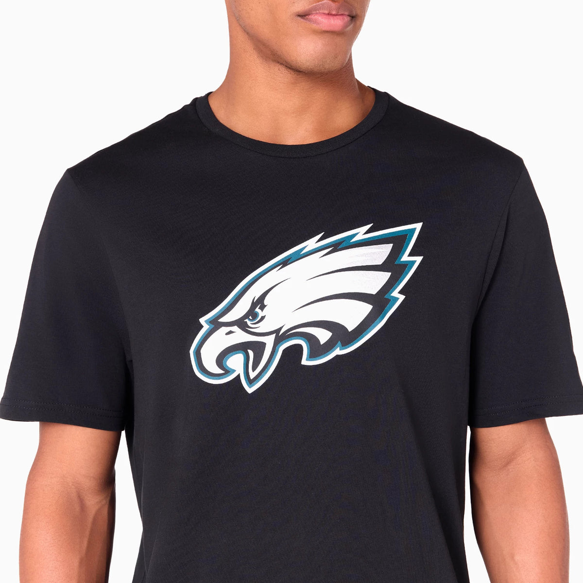 New Era Philadelphia Eagles NFL Black T-Shirt, front view showing the large graphic eagle logo printed in white and teal on the chest, set against a plain black fabric with a crew neck.