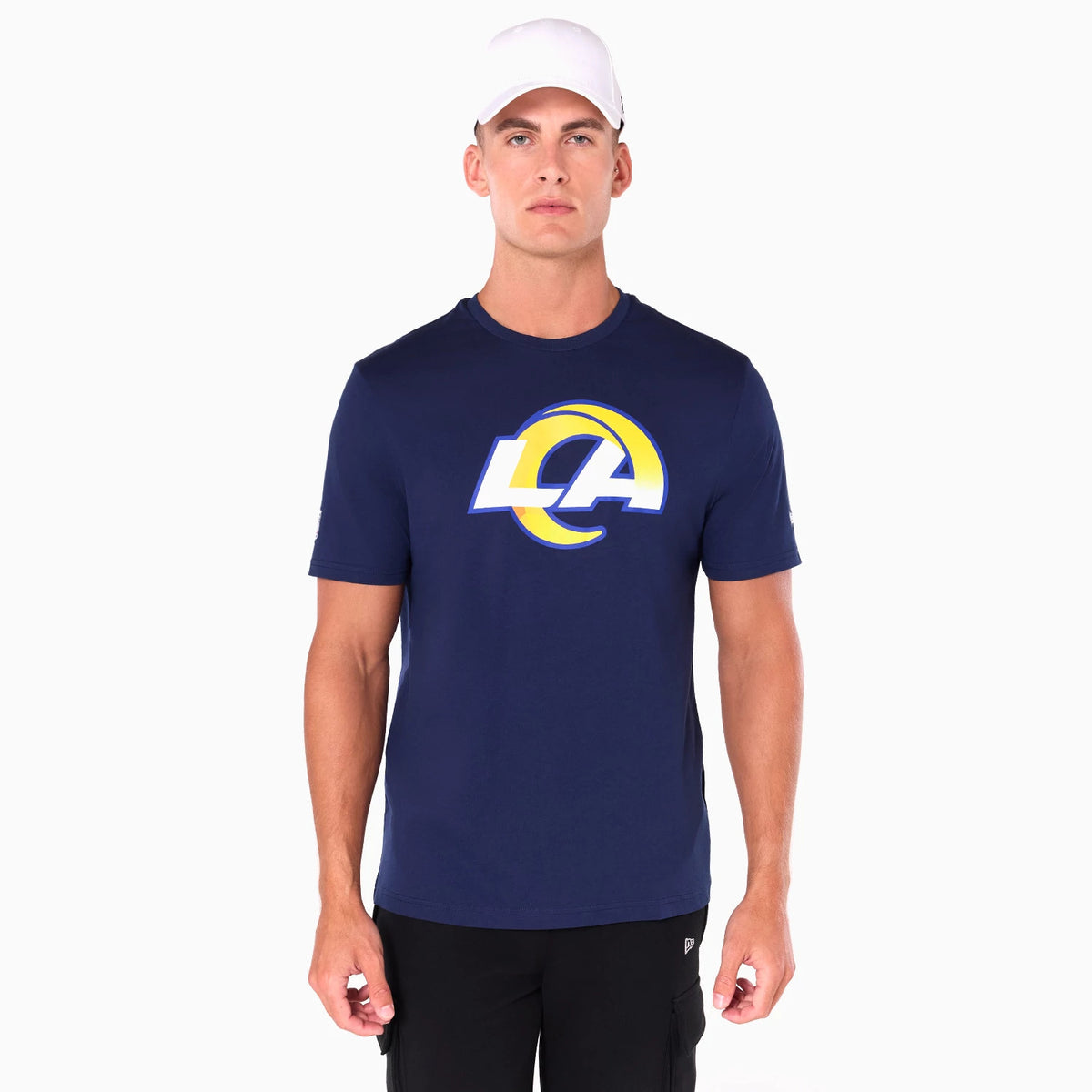 New Era LA Rams NFL Navy T-Shirt, front view showing the bold LA Rams logo in yellow and white prominently centred on the chest of the dark navy t-shirt worn by a model, with short sleeves and a round neckline.