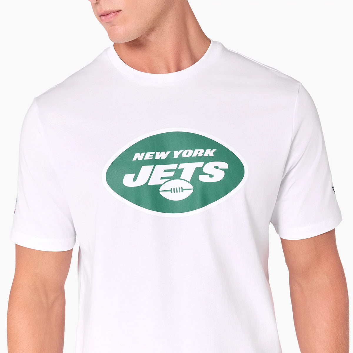 New Era New York Jets NFL White T-Shirt, front view showing a bold green oval logo with New York Jets and a football graphic printed in white on the chest, short sleeves with a small debossed New Era logo on the left cuff.