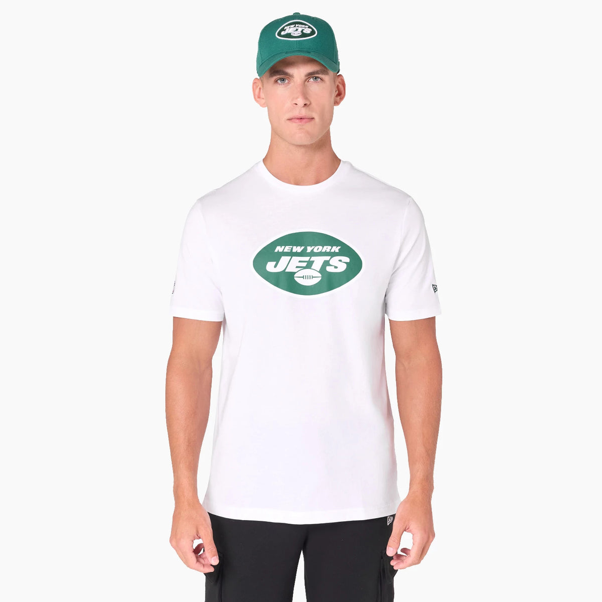 New Era New York Jets NFL White T-Shirt, on-model view showing a white shirt with a green oval New York Jets logo on the chest, paired with a matching green cap featuring an embroidered New York Jets logo on the front.