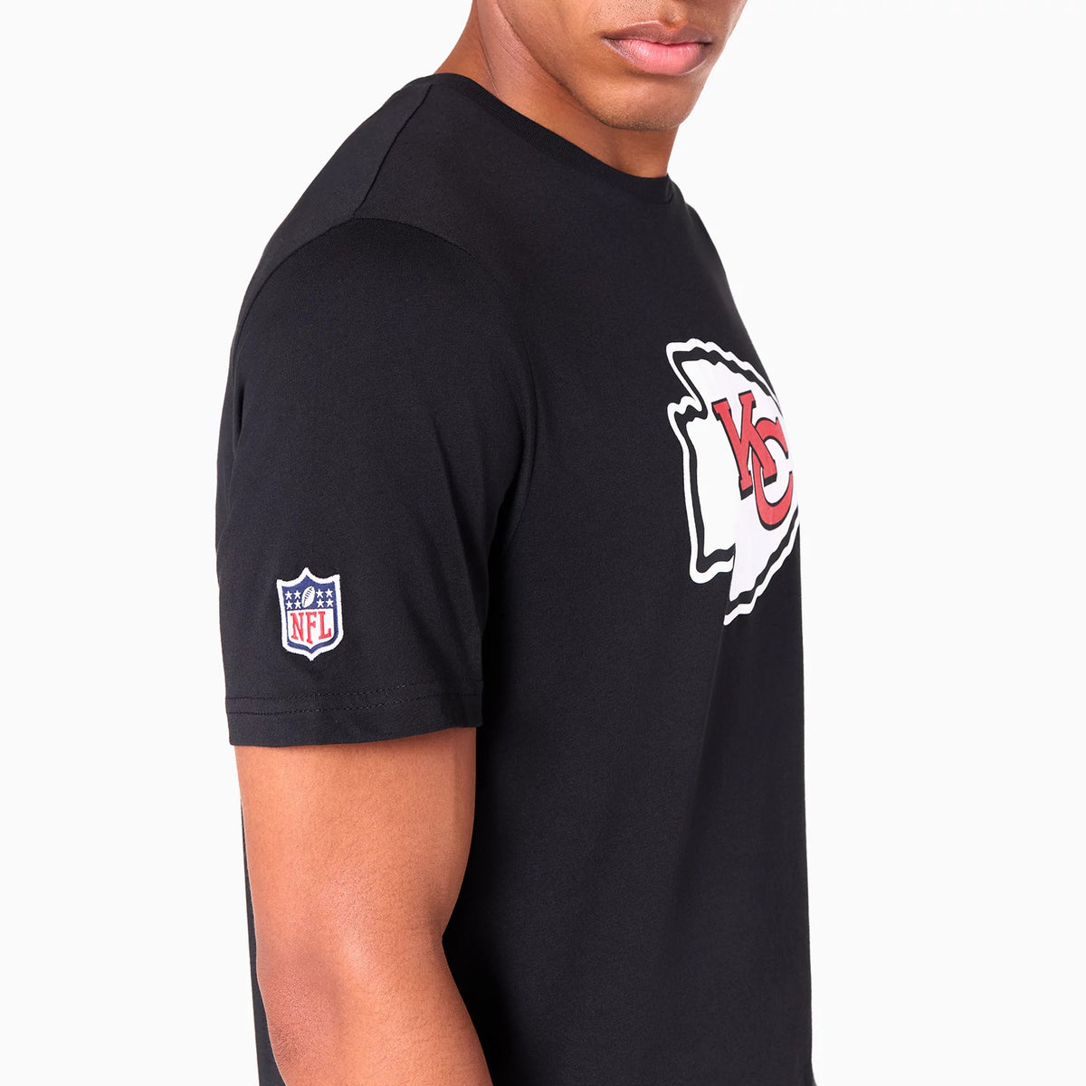 New Era Kansas City Chiefs NFL Black T-Shirt, side view showing the black fabric with a large white and red KC Chiefs logo on the chest and the embroidered NFL shield on the left sleeve.