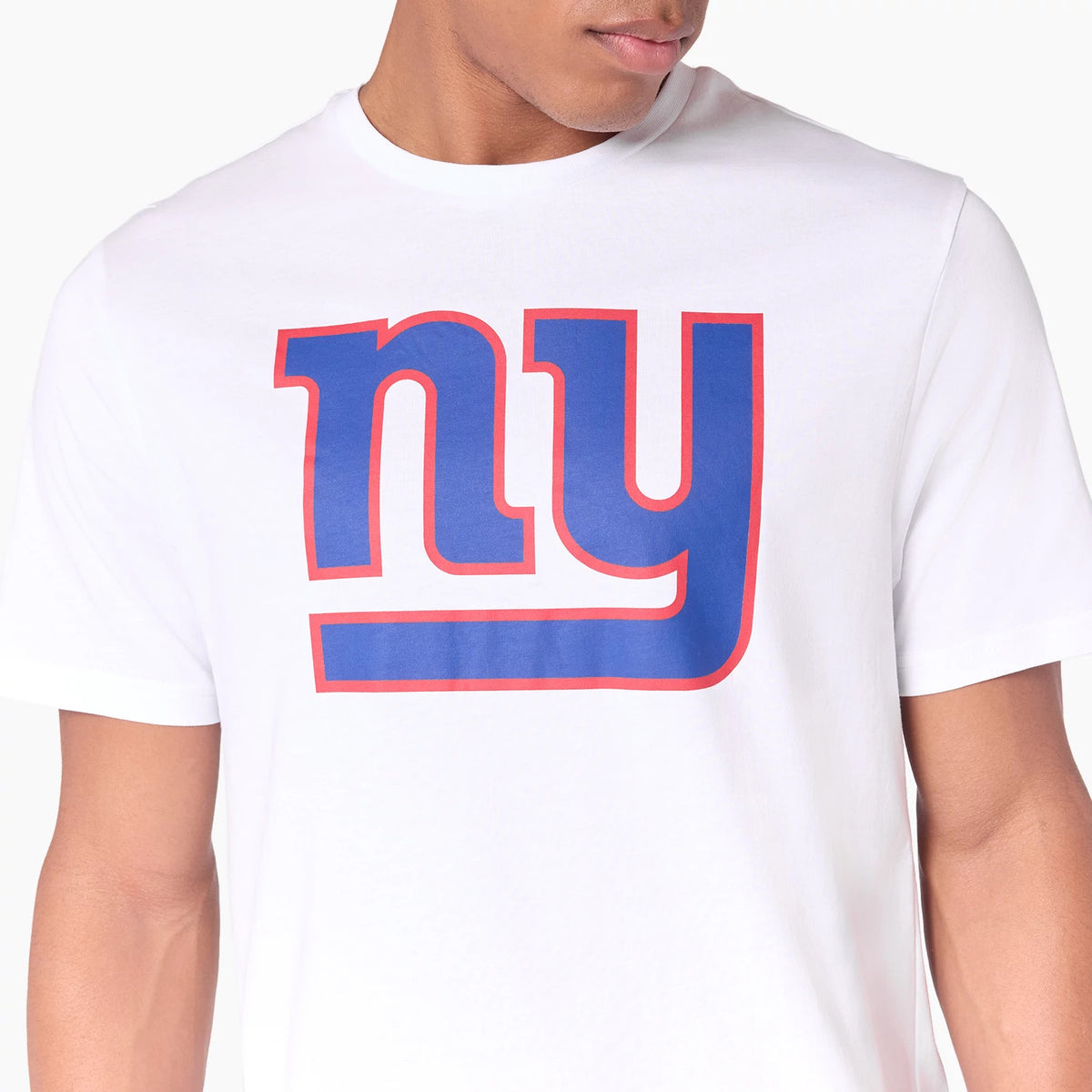 New Era New York Giants NFL White T-Shirt, front view showing a large blue and red outlined ny logo printed across the chest, highlighting the bold team graphics on the plain white fabric.