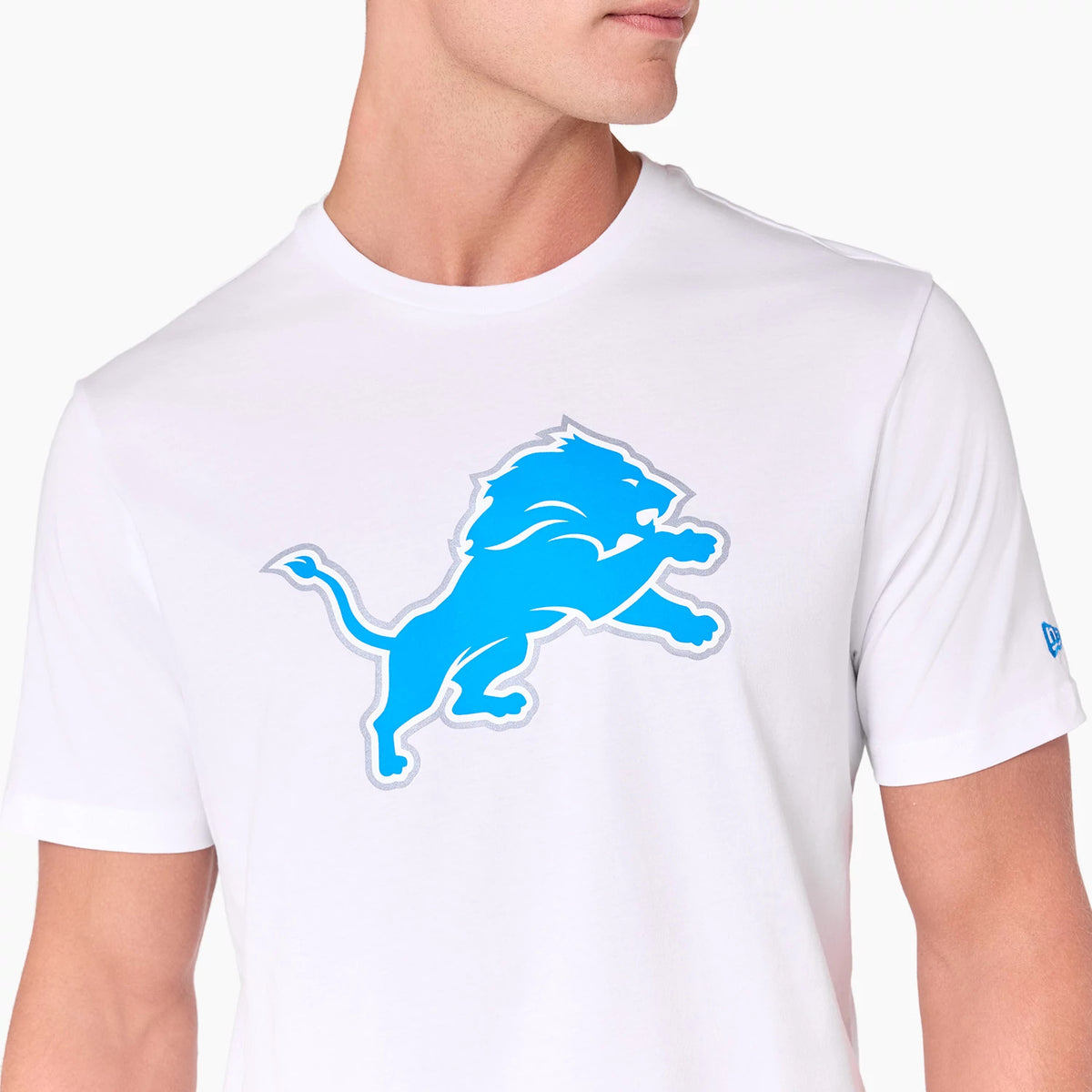 New Era Detroit Lions NFL White T-Shirt, front view showing the large blue lion logo printed in the centre of the white fabric, a small blue embroidered New Era logo on the left sleeve.