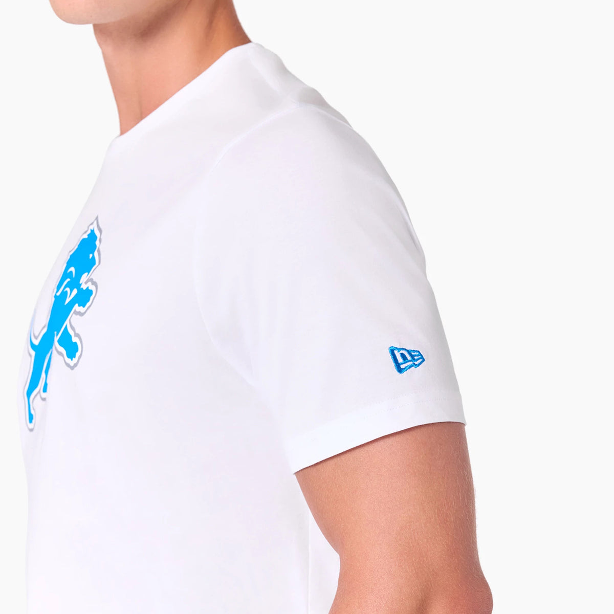 New Era Detroit Lions NFL White T-Shirt, side view showing a blue embossed logo of a lion on the chest and a small blue embossed New Era logo on the left sleeve against the white fabric.