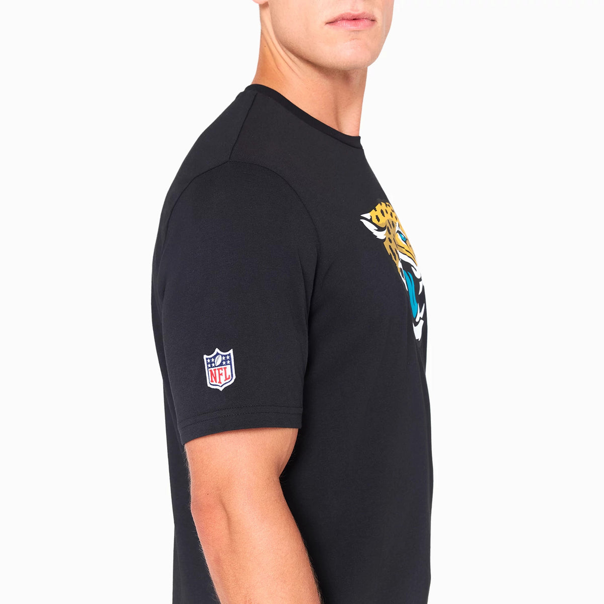 New Era Jacksonville Jaguars NFL Black T-Shirt, side view showing the large jaguar logo printed on the chest, an embroidered NFL logo on the sleeve, and the round neck with short sleeves.