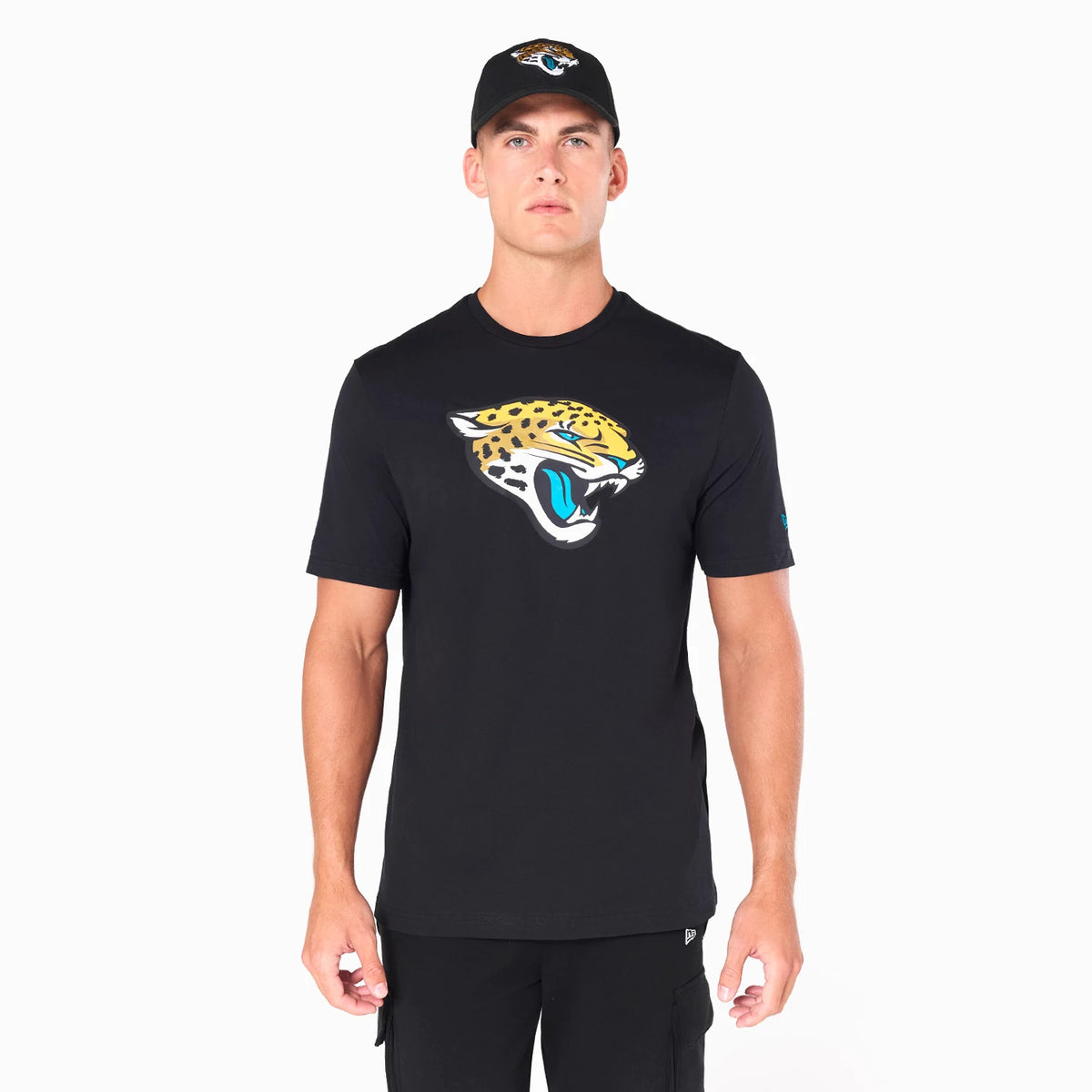 New Era Jacksonville Jaguars NFL Black T-Shirt, front view showing the large Jacksonville Jaguars logo printed on the chest, worn by a model also wearing a black cap with an embroidered Jaguars logo on the front.