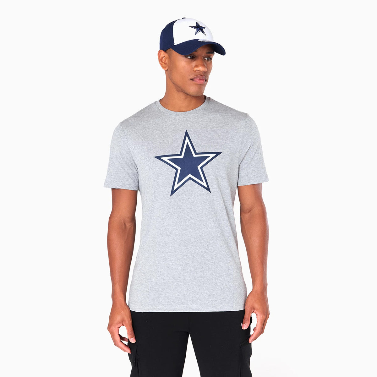 New Era Dallas Cowboys NFL Grey T-Shirt, on-model view showing the grey short-sleeved shirt with a large navy outlined star on the chest, paired with a cap featuring a matching star logo on the front panel.